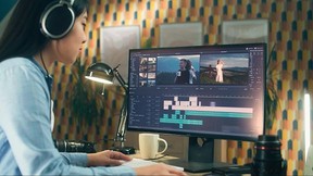 Woman Editing Video In Professional Software
